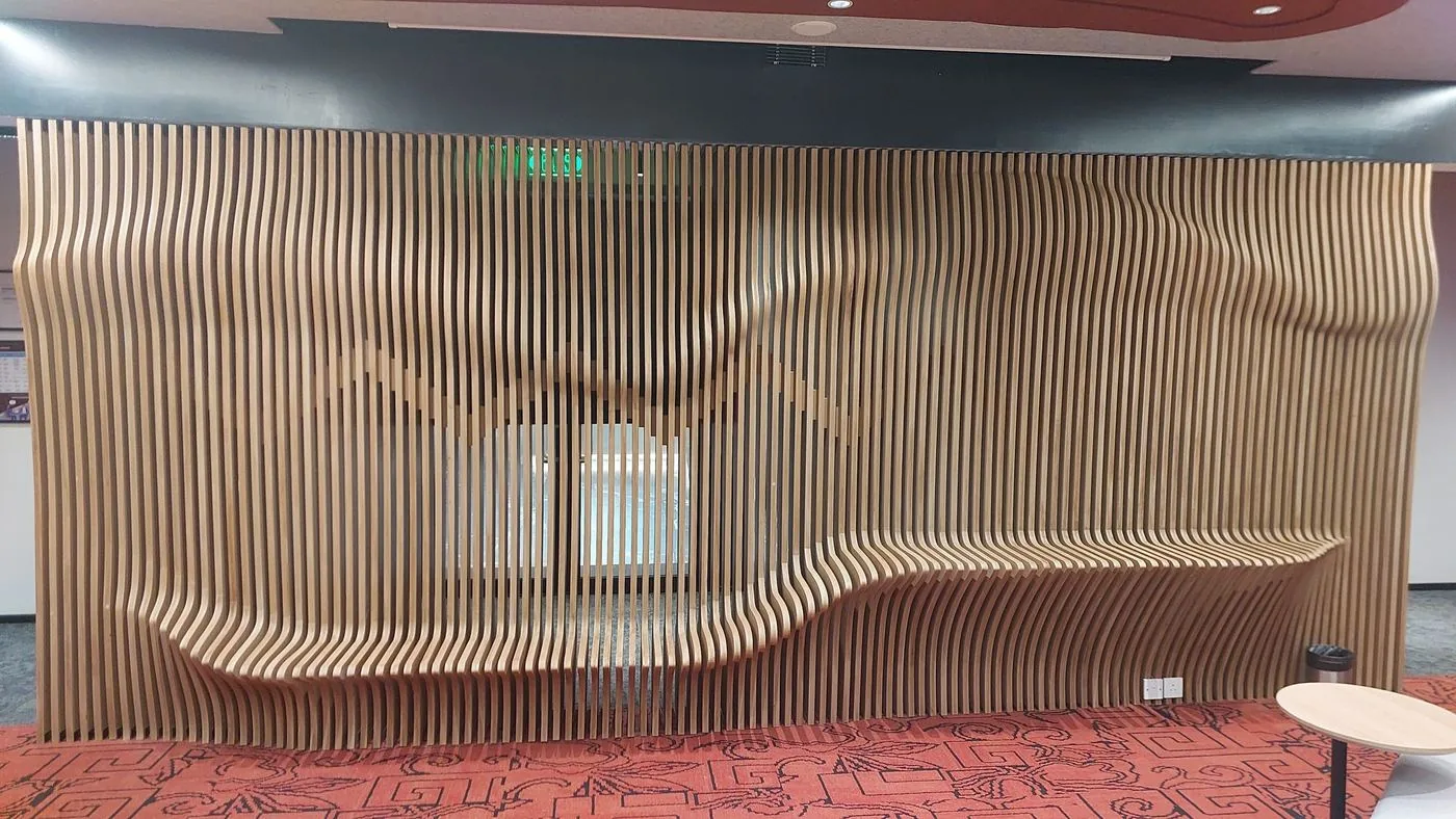 Full view of the sculpted timber fin wall with built-in seating at the ArchEdge office